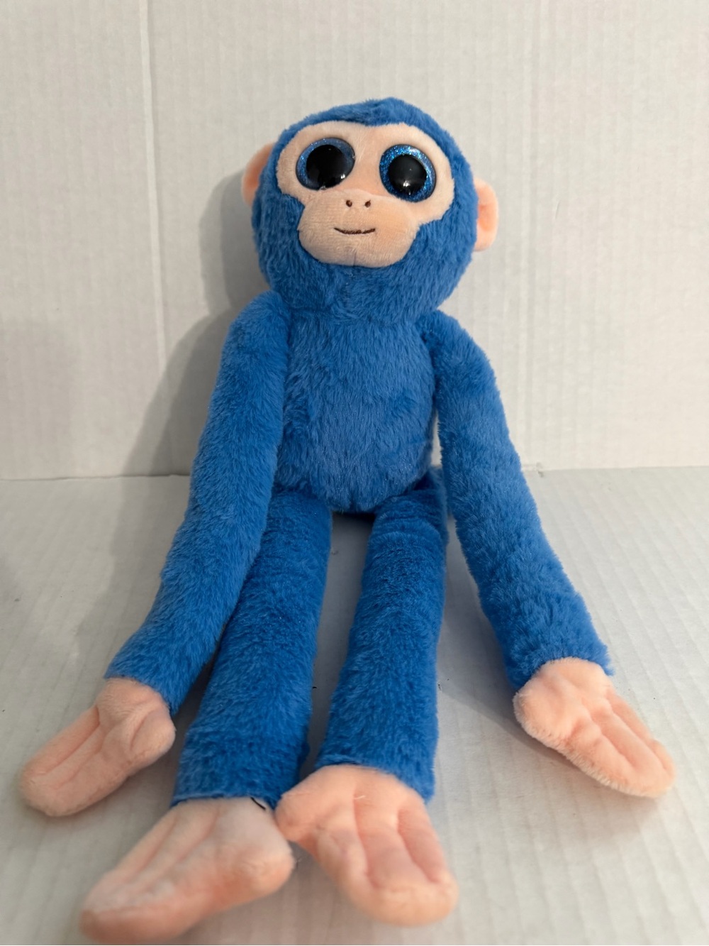 US Fun Machines Glitter Eyes Blue Spider Monkey Plush